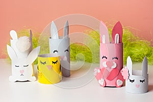DIY bunny for kids. Easter home activities. Handmade cute toy rabbits. Reuse concept. Art from paper tube.