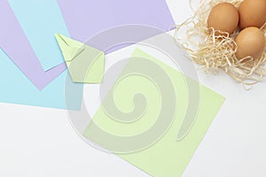 DIY Children's Easter craft bunny with an egg. Step 12. Easter paper step by step instructions. Happy bunny