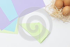 DIY Children's Easter craft bunny with an egg. Step 3. Easter paper step by step instructions. Happy bunny holds