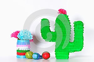 Diy cinco de mayo Mexican Pinata Cactus made cardboard, crepe paper your own hands blue background photo