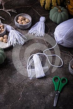 DIY craft Halloween garland in shape of ghost. photo