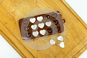 DIY Cute Mini heart bath bomb from silicone chocolate mold on wooden tray