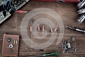 DIY. Do it yourself. Workplace with soldering iron, tools and electronic components background