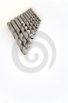 DIY drill bits on plain background