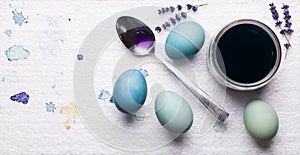 DIY dyed using red cabbage various shades of blue easter eggs drying on piece of polystyrene. DIY Happy Easter.