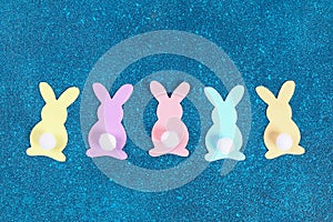 Diy Easter garland bunnies, flags EASTER made paper blue background. Gift idea, decor Spring, Easter