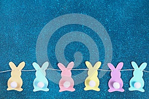 Diy Easter garland bunnies, flags EASTER made paper blue background. Gift idea, decor Spring, Easter