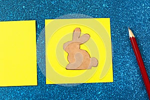 Diy Easter garland bunnies, flags EASTER made paper blue background. Gift idea, decor Spring, Easter