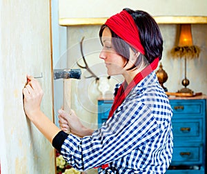 Diy fashion woman with nail and hammer photo