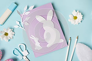 DIY ideas instruction for making Easter Card. handmade card on blue background with flowers