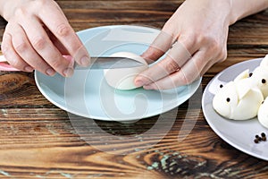 DIY instruction. Step by step guide. Making a funny rabbit from boiled eggs, decorating the Easter table, Easter decor and serving