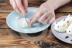 DIY instruction. Step by step guide. Making a funny rabbit from boiled eggs, decorating the Easter table, Easter decor and serving