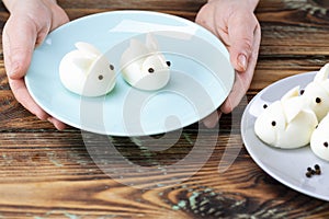 DIY instruction. Step by step guide. Making a funny rabbit from boiled eggs, decorating the Easter table, Easter decor and serving