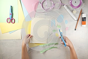 DIY and kids creativity. Step by step instruction: how to make card Happy easter. Step1 preparation tools colored paper  scissors