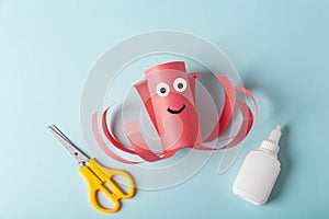 DIY and kids creativity. Step by step instruction: how to make octopus from toilet roll tube. Step3 finished craft with glued