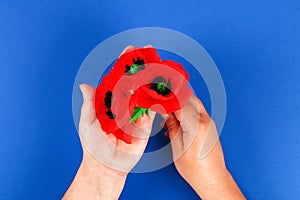 Diy paper red poppy Anzac Day, Remembrance, Remember, Memorial day crepe paper on blue background