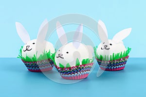 Diy rabbit from easter eggs on blue background. Gift ideas, decor Easter, spring. Handmade