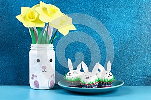 Diy rabbit from easter eggs on blue background. Gift ideas, decor Easter, spring. Handmade