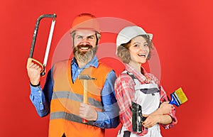 DIY repair. Construction workers. Home renovation. Couple renovating house. Woman builder hard hat. Man engineer or