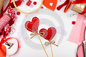 DIY step-by-step instructions for Valentine`s Day. Heart with wings on a felt stick. Step 9