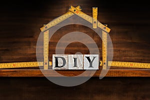 DIY Text made of Wooden Blocks and Folding ruler in the Shape of a House