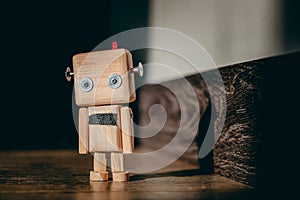 diy wooden toy robot stands on a wooden floor