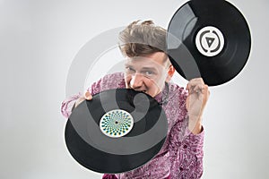 DJ biting vinyl record