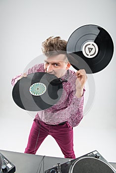 DJ biting vinyl record