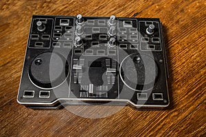 Dj Controller old, on with table wood.