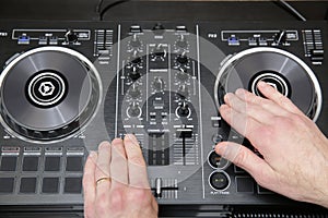 DJ equipment controller or mixer and headphones, laptop. Music background, banner. Modern technologies