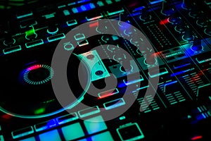 DJ Jog wheel Sliders & Knobs of Colorful DJ Controller in club party