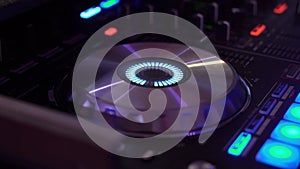 DJ mixer in nightclub. Spinning, mixing and scratching - playing music at party.