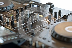 Dj mixer at a party playing rock pop regueton music