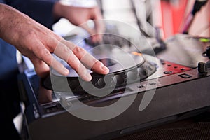 Dj mixes the track in the nightclub