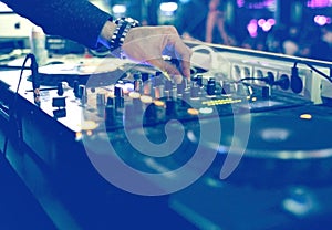 DJ mixing desk at party