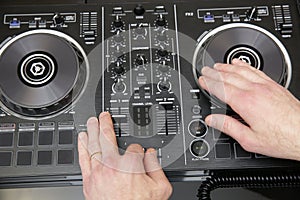 Dj mixing the music. Music background, banner. Close-up. Modern technologies