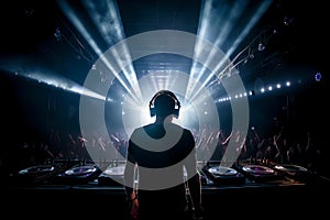 Dj in a nightclub scene with lights and lasers. Night scene of electronic music over the audience and crowd