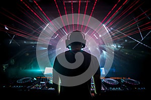 Dj in a nightclub scene with lights and lasers. Night scene of electronic music over the audience and crowd