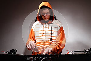 DJ playing music on vinyl turntables