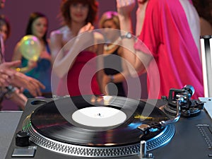 Dj's turntable closeup in a night club