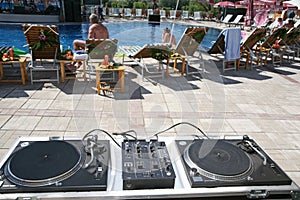 DJ stand near a pool