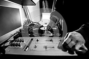 Dj in studio with turntable and mixer