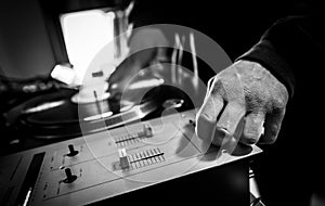 Dj in studio with turntable and mixer
