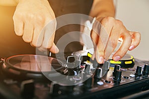 DJ turntable console mixer controlling