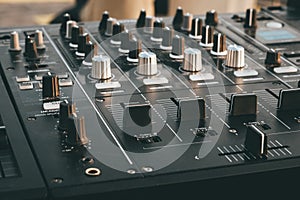DJ turntable deck mixer close up, sound equipment, audio control panel for party, night clubs or music studio
