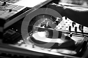 Dj turntables mixing party music in disco black and white