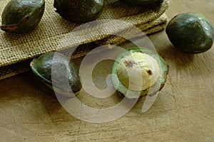 Djenkol bean or luk nieng fruit tropical plant on wooden board