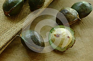 Djenkol bean or luk nieng fruit tropical plant on wooden board