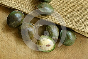 Djenkol bean or luk nieng fruit tropical plant on wooden board