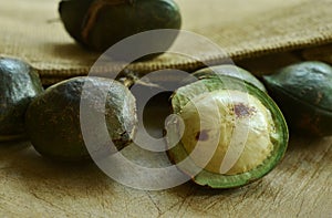 Djenkol bean or luk nieng fruit tropical plant on wooden board